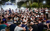 Orthodox Jews pray on the Tisha B'Av day of mourning, in Tel Aviv on July 26, 2023. (Avshalom Sassoni/Flash90)