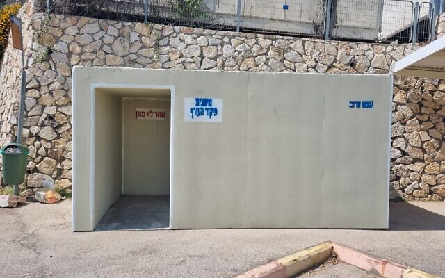 A mobile shelter in a parking lot near a school in Kibbutz Kabri, 2024. (Tani Goldstein)