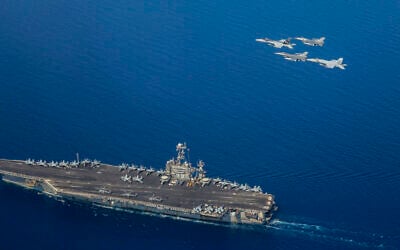 Illustrative: This handout photo shows US Navy F/A-18E Super Hornets, attached to Carrier Air Wing 1 (CVW-1) and Belgian Air Force F-16s flying over the Nimitz-class aircraft carrier USS Harry S. Truman (CVN 75) in the Mediterranean Sea, July 25, 2022. (Christina SEARS / US NAVY / AFP) Illustrative: This handout photo shows US Navy F/A-18E Super Hornets, attached to Carrier Air Wing 1 (CVW-1) and Belgian Air Force F-16s flying over the Nimitz-class aircraft carrier USS Harry S. Truman (CVN 75) in the Mediterranean Sea, July 25, 2022. (Christina SEARS / US NAVY / AFP)
