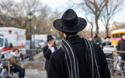 Illustrative: Hasidim gather outside of the Chabad-Lubavitch global headquarters in Crown Heights, Brooklyn, New York, January 12, 2024. (Spencer Platt/Getty Images/AFP)