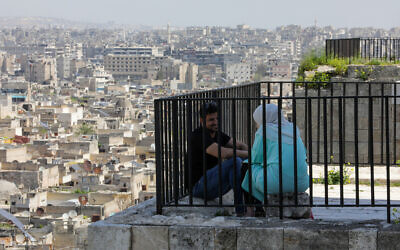 People visit the Citadel of Aleppo in northern Syria on March 31, 2024, during the Muslim holy fasting month of Ramadan. (LOUAI BESHARA / AFP)