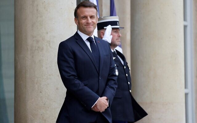 French President Emmanuel Macron waits for Lebanese Prime Minister's arrival before their meeting at the Elysee Palace in Paris on April 19, 2024. (Photo by Ludovic MARIN / AFP)