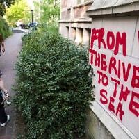 Illustrative: Graffiti reading 'From the river to the sea' on a building adjacent to an encampment at the University of Washington, in Seattle, Washington, May 12, 2024. (Jason Redmond / AFP)