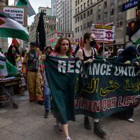 Illustrative: Anti-Israel activists march outside of the CUNY Grad Center on July 22, 2024 in New York City. (Spencer Platt/Getty Images/AFP)