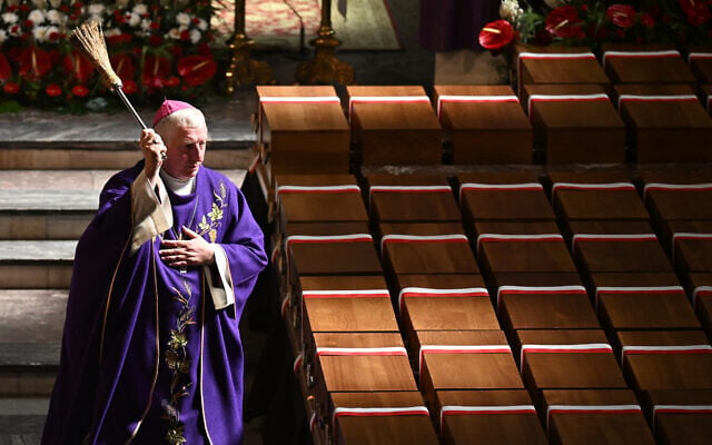A Catholic priest conducts a funeral service for remains of over 700 victims of German crimes of the World War II, discovered in the so-called Valley of Death, at the Minor Basilica of the Holy Trinity of St. John the Baptist in Chojnice, Poland, on September 2, 2024. (Sergei GAPON / AFP) A Catholic priest conducts a funeral service for remains of over 700 victims of German crimes of the World War II, discovered in the so-called Valley of Death, at the Minor Basilica of the Holy Trinity of St. John the Baptist in Chojnice, Poland, on September 2, 2024. (Sergei GAPON / AFP)