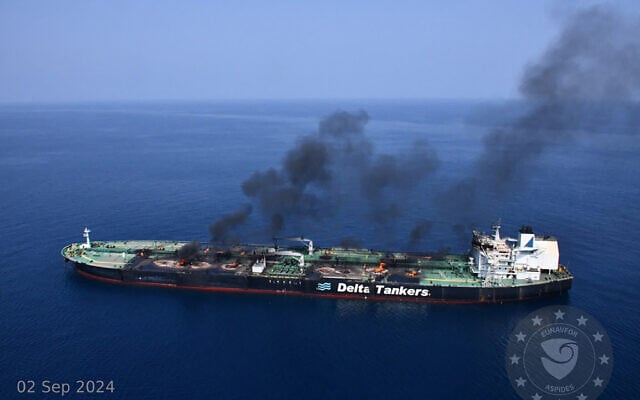 This handout picture provided by EUNAVFOR ASPIDES on September 5, 2024, and dated September 2, shows smoke and fire aboard the Greek-owned oil tanker Sounion off the coast of Hodeida in the Red Sea (EUNAVFOR ASPIDES / AFP)