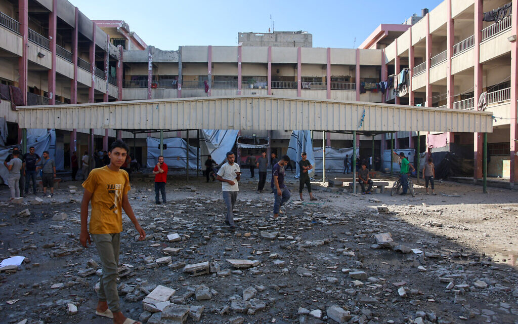 Palestinians inspect the damage following an IDF strike on a Hamas cell embedded in the Amr Ibn al-Aas School in Gaza City's Sheikh Radwan neighborhood on September 7, 2024. (Omar al-Qattaa/AFP)