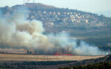 Smoke rises in the southern Lebanese Marjayoun plain after being hit by Israeli shelling on September 7, 2024. The northern Israeli town of Metula can be seen in the background. (Rabih Daher/AFP)