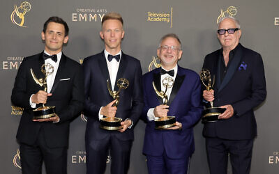 Benj Pasek (from left), Justin Paul, Marc Shaiman, and Scott Wittman, pose with their Emmy Award for their work on 'Only Murders in the Building' at Peacock Theater on September 8, 2024 in Los Angeles, California. (KEVIN WINTER Getty Images via AFP)