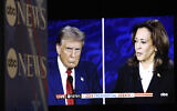 US Vice President and Democratic presidential candidate Kamala Harris and former US president and Republican presidential candidate Donald Trump are seen on a screen in the spin room as they participate in a presidential debate at the National Constitution Center in Philadelphia, Pennsylvania, on September 10, 2024. (Matthew Hatcher/AFP)
