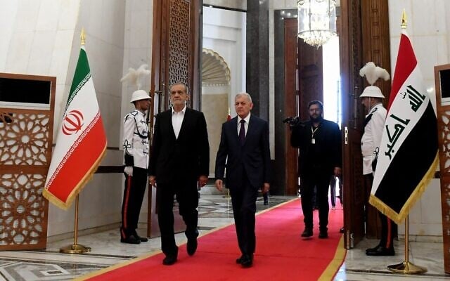 This handout photograph released by the Iraqi President's Office shows Iraq's President Abdul Latif Rashid, right, welcoming his counterpart from Iran Masoud Pezeshkian in Baghdad on September 11, 2024. (Iraqi Presidency Media Office / AFP) This handout photograph released by the Iraqi President's Office shows Iraq's President Abdul Latif Rashid, right, welcoming his counterpart from Iran Masoud Pezeshkian in Baghdad on September 11, 2024. (Iraqi Presidency Media Office / AFP)