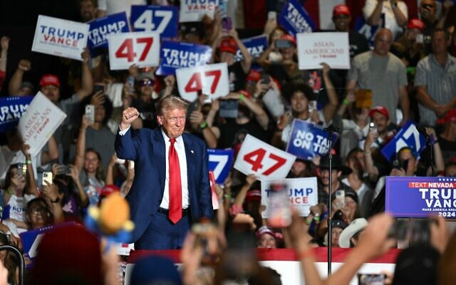Former US President and Republican presidential candidate Donald Trump raises a fist on stage during a campaign rally at the Expo World Market Center in Las Vegas, Nevada, on September 13, 2024. (Patrick T. Fallon / AFP) Former US President and Republican presidential candidate Donald Trump raises a fist on stage during a campaign rally at the Expo World Market Center in Las Vegas, Nevada, on September 13, 2024. (Patrick T. Fallon / AFP)