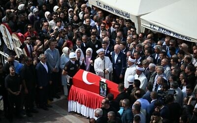 Relatives and officials look at the coffin of Turkish-American activist Aysenur Ezgi Eygi, who the IDF says was likely shot dead inadvertently by Israeli forces while protesting against Israeli settlements in the West Bank, during her funeral ceremony at the Didim central mosque in Aydin Province on September 14, 2024. (OZAN KOSE / AFP)