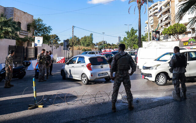 Lebanese soldiers block an entrance of a Beirut southern suburb on September 17, 2024, after explosions hit locations in several Hezbollah strongholds around the country. (Ibrahim Amro/AFP)