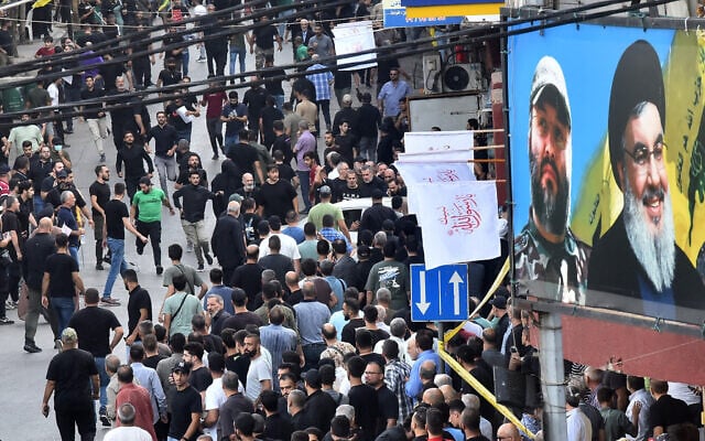 People react after a device explosion occurred during the funeral of people killed when hundreds of Hezbollah pagers exploded across Lebanon the previous day, in Beirut's southern suburbs on September 18, 2024. Israel has been blamed for the attacks (Photo by Fadel ITANI / AFP) People react after a device explosion occurred during the funeral of people killed when hundreds of Hezbollah pagers exploded across Lebanon the previous day, in Beirut's southern suburbs on September 18, 2024. Israel has been blamed for the attacks (Photo by Fadel ITANI / AFP)