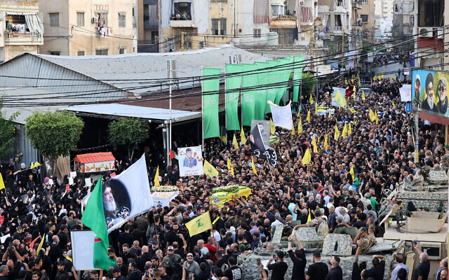 Mourners carry the coffins of Hezbollah members killed after hundreds of their paging devices exploded in a deadly wave across Lebanon the previous day, during a funeral procession in Beirut's southern suburbs on September 18, 2024. Israel has been blamed. (ANWAR AMRO / AFP) Mourners carry the coffins of Hezbollah members killed after hundreds of their paging devices exploded in a deadly wave across Lebanon the previous day, during a funeral procession in Beirut's southern suburbs on September 18, 2024. Israel has been blamed. (ANWAR AMRO / AFP)