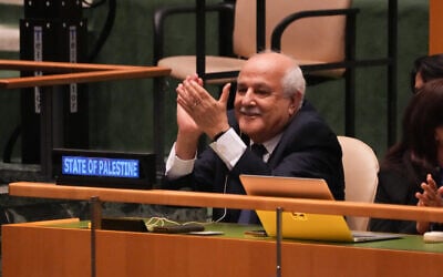 Palestinian representative Ryad Mansour applauds the result of a vote during the emergency session on the legal consequences of Israel's actions in the Palestinian territories at United Nations Headquarters in New York, on September 18, 2024. (Bryan Smith / AFP)