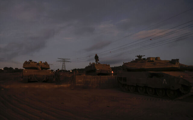 An Israeli soldier stands atop an armoured vehicle in the Golan Heights on September 19, 2024. (Jalaa Marey/AFP)