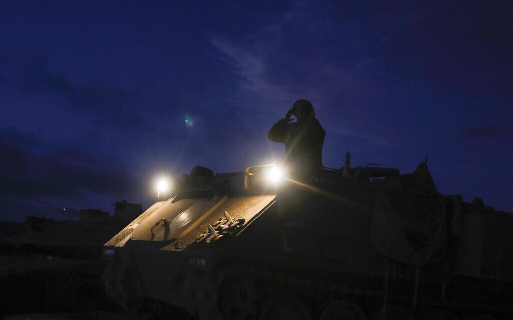 An Israeli soldier stands atop an armored vehicle in the Golan Heights on September 19, 2024. (Jalaa MAREY / AFP)