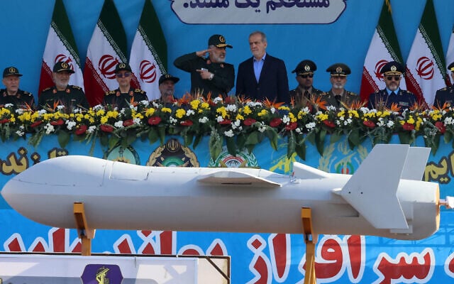 Iranian President Masoud Pezeshkian (R) and commander of the Islamic Revolutionary Guard Corps' Aerospace Force Amir Ali Hajizadeh look on as Iran's new Shahed 136-B drone is displayed during the annual military parade marking the anniversary of the outbreak of the 1980-1988 war with Saddam Hussein's Iraq, in Tehran on September 21, 2024. (Atta Kenare/AFP) Iranian President Masoud Pezeshkian (R) and commander of the Islamic Revolutionary Guard Corps' Aerospace Force Amir Ali Hajizadeh look on as Iran's new Shahed 136-B drone is displayed during the annual military parade marking the anniversary of the outbreak of the 1980-1988 war with Saddam Hussein's Iraq, in Tehran on September 21, 2024. (Atta Kenare/AFP)