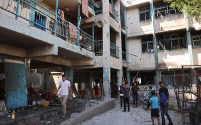 Palestinians inspect damage at the site of an Israeli strike on a school housing displaced Palestinians and allegedly Hamas operatives in Gaza City's Zeitoun neighborhood on September 21, 2024. (Omar Al-Qattaa/AFP)
