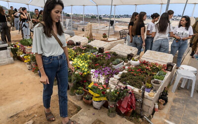 Adi Levy-Slama, who lost five relatives during the October 7 attack, attends memorial ceremony for the Kutz family at the Gan-Yavne cemetery in southern Israeli town of Be'er Tuvia on September 5, 2024. (Menahem KAHANA / AFP)