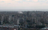An image grab taken from an AFPTV video taken on September 23, 2024, shows smoke billowing over the southern suburbs of Beirut after an Israeli strike.(Mohamad Al Ghandour/ AFPTV/ AFP)