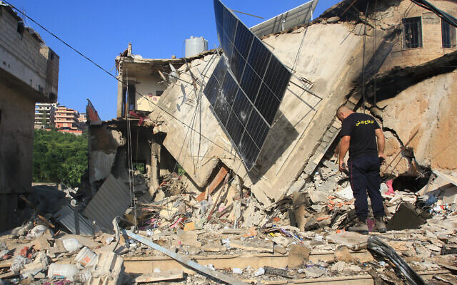 A rescuer inspects the debris at the site of an overnight Israeli strike in the southern Lebanese village of Akbiyeh on September 24, 2024 (Mahmoud ZAYYAT / AFP) A rescuer inspects the debris at the site of an overnight Israeli strike in the southern Lebanese village of Akbiyeh on September 24, 2024 (Mahmoud ZAYYAT / AFP)