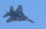 Illustrative: An Israeli Air Force F-15 Eagle fighter aircraft flies over Haifa on September 24, 2024. (Jack Guez/AFP)