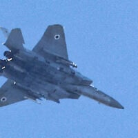 Illustrative: An Israeli Air Force F-15 Eagle fighter aircraft flies over Haifa on September 24, 2024. (Jack Guez/AFP)