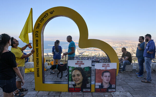 People gather around an installation dedicated to hostages held by Hamas in Gaza since October 7, at a spot overlooking the northern city of Haifa on September 25, 2024. (Ahmad Gharabli/AFP) People gather around an installation dedicated to hostages held by Hamas in Gaza since October 7, at a spot overlooking the northern city of Haifa on September 25, 2024. (Ahmad Gharabli/AFP)