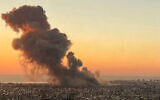 Smoke rises above Beirut's southern suburbs during an Israeli strike on September 27, 2024. (AFP)