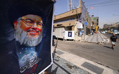 A portrait of Hezbollah's leader Hassan Nasrallah hangs on a street in Baghdad on September 29, 2024, after Iraq officially declared a three-day national mourning period following Israel's killing of the Lebanese leader. (Ahmad Al-Rubaye / AFP)