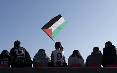 A Club Palestino fan waves a Palestinian flag during a local league soccer match against Santiago Wanderers at La Cisterna stadium in Santiago, Chile, Friday, July 12, 2024. (AP Photo/Matias Basualdo) A Club Palestino fan waves a Palestinian flag during a local league soccer match against Santiago Wanderers at La Cisterna stadium in Santiago, Chile, Friday, July 12, 2024. (AP Photo/Matias Basualdo)