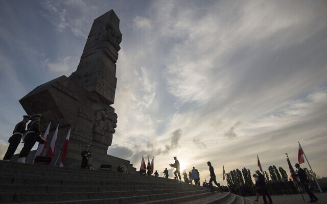 People lay a wreath at the monument to the 1939 heroic defense of the Westerplatte peninsula outpost during solemn observances of the 85th anniversary of the outbreak of World War II, at Westerplatte, on the Baltic Sea, Poland, September 1, 2024. (Wojciech Strozyk/AP) People lay a wreath at the monument to the 1939 heroic defense of the Westerplatte peninsula outpost during solemn observances of the 85th anniversary of the outbreak of World War II, at Westerplatte, on the Baltic Sea, Poland, September 1, 2024. (Wojciech Strozyk/AP)