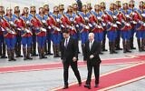Russian President Vladimir Putin, right, walks with Mongolian President Ukhnaagiin Khurelsukh, left, during a welcoming ceremony at Sukhbaatar Square in Ulaanbaatar, Mongolia, September 3, 2024. (Sofya Sandurskaya, Sputnik, Kremlin Pool Photo via AP)