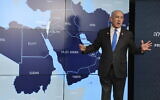 Prime Minister Benjamin Netanyahu stands before a map during a press conference at the Government Press Office in Jerusalem, September 4, 2024. (Abir Sultan/Pool via AP)