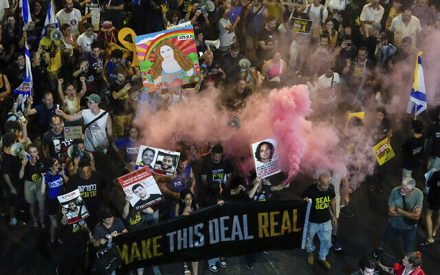 People attend a rally demanding a ceasefire deal and the immediate release of hostages held by Hamas in the Gaza Strip in Tel Aviv, September 4, 2024. (Ariel Schalit/AP) People attend a rally demanding a ceasefire deal and the immediate release of hostages held by Hamas in the Gaza Strip in Tel Aviv, September 4, 2024. (Ariel Schalit/AP)
