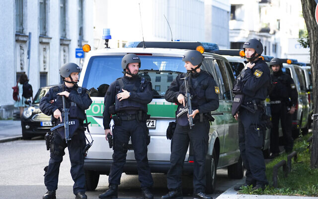 Police officers patrol after police fired shots at a suspicious person near the Israeli Consulate and a museum on the city's Nazi-era history in Munich, Germany, Thursday, Sept. 5, 2024. (AP Photo/Matthias Schrader)