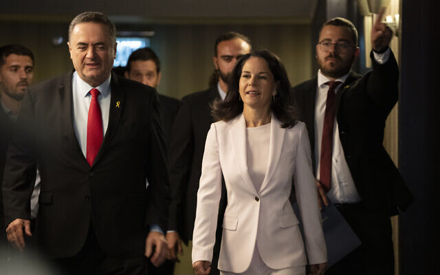 Foreign Minister Israel Katz, left, arrives with his German counterpart Annalena Baerbock, for a meeting in Tel Aviv, Israel, Sept. 6, 2024. (AP Photo/Leo Correa)