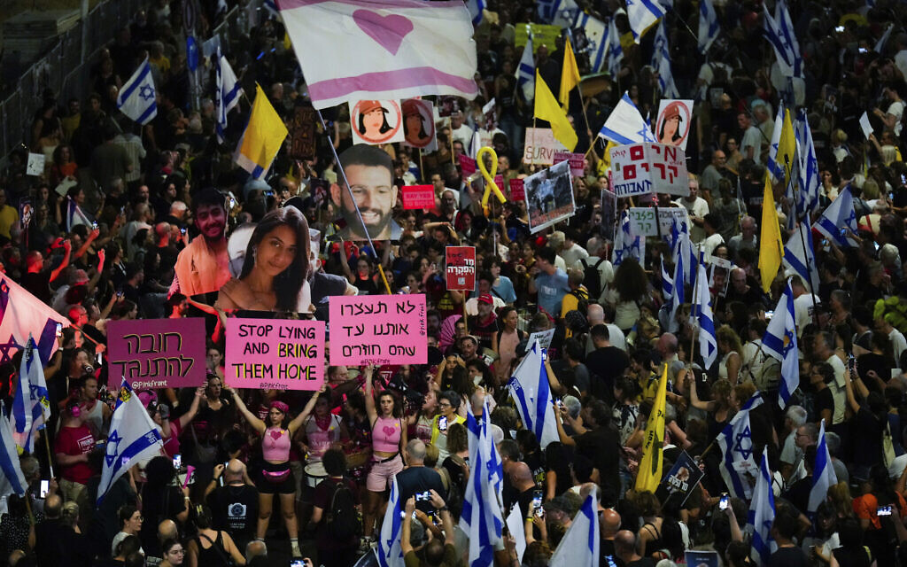People protest against Prime Minister Benjamin Netanyahu's government and call for the release of hostages held in the Gaza Strip by Hamas, in Tel Aviv, Israel, Saturday, Sept. 7, 2024. (AP Photo/Ariel Schalit)