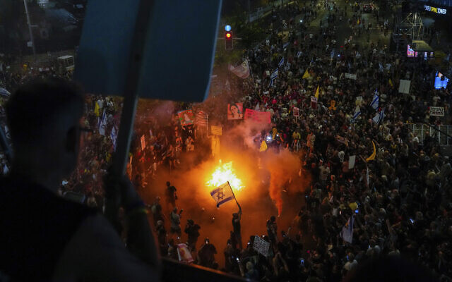 People protest against Prime Minister Benjamin Netanyahu's government and call for a deal for the release of hostages held in the Gaza Strip by the Hamas terror group, in Tel Aviv, Israel, Sept. 7, 2024. (AP Photo/Ariel Schalit)