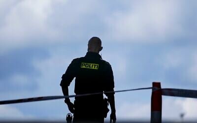 Illustrative: A police officer guards in Copenhagen, Denmark, on July 4, 2022. (AP Photo/Sergei Grits, File)