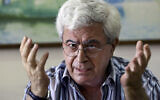 Lebanese writer Elias Khoury speaks during an interview with The Associated Press at his office in the Institute for Palestine Studies in Beirut, Lebanon, August 8, 2014. (AP Photo/Bilal Hussein, File)