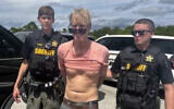 Law enforcement officers arrest Ryan Routh, the man suspected in the apparent assassination attempt of Donald Trump, in Martin County, Florida, September 15, 2024. (Martin County Sheriff’s Office via AP)