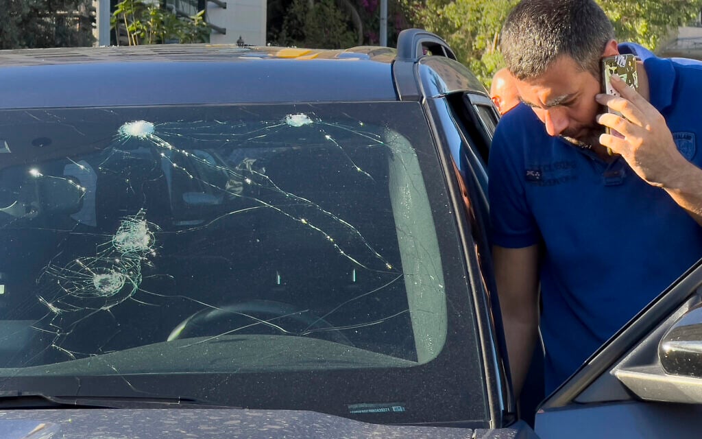 A police officer inspects a car in which a hand-held pager exploded, in Beirut, Lebanon, September 17, 2024. (AP Photo/Hussein Malla)
