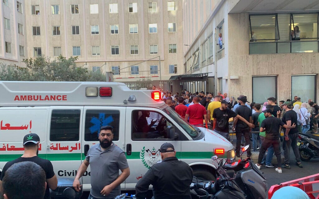 People gather outside the American University hospital after the arrival of several men who were wounded by exploded handheld pagers, in Beirut, Lebanon, September 17, 2024. (AP Photo/Bassam Masri)