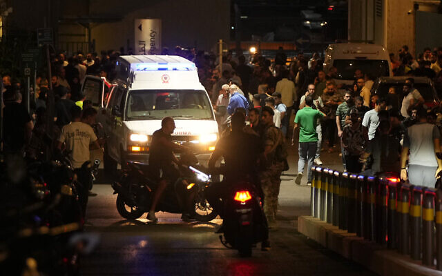 People gather around an ambulance carrying wounded people whose handheld pager exploded, at the emergency entrance of the American University hospital in Beirut, Lebanon, September 17, 2024, after an attack, blamed on Israel, targeting Hezbollah fighters. (AP Photo/Hassan Ammar) People gather around an ambulance carrying wounded people whose handheld pager exploded, at the emergency entrance of the American University hospital in Beirut, Lebanon, September 17, 2024, after an attack, blamed on Israel, targeting Hezbollah fighters. (AP Photo/Hassan Ammar)