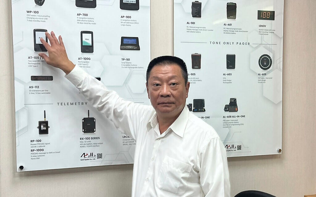 Hsu Ching-kuang, chairman of Apollo Gold, talks about the Taiwan company's communication products at the headquarters in New Taipei City, Taiwan Sept. 18, 2024. (AP Photo/Johnson Lai)
