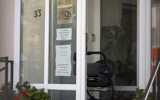 This shows a sing featuring the names of several companies on the door of a house where a Hungarian company that allegedly manufactured pagers that exploded in Lebanon and Syria in an attack blamed on Israel, is headquartered in Budapest, Sept. 18, 2024. (AP Photo/Denes Erdos)